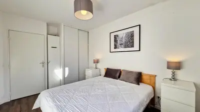 a living room with a couch and a table at Résidence Les Pleiades - Appartement lumineux · Centre station · Balcon MAE-7393 in Flaine