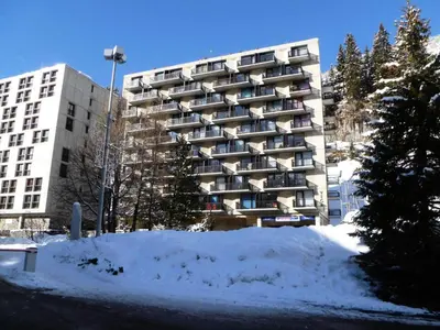 a tall building with snow in front of it at Résidence Vega - Studio lumineux · Proche des pistes et des commerces · Balcon MAE-7400 in Flaine
