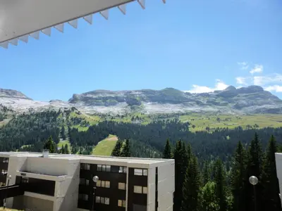 a view of the mountains from a building at Résidence La Petite Ourse - Studio neuf · Centre station · Balcon MAE-7402 in Flaine