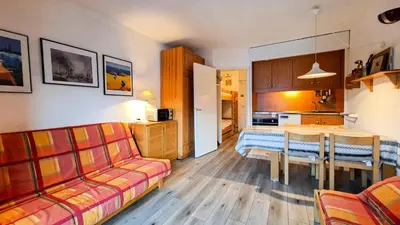 a living room with a couch and a table at Résidence Andromede - Studio lumineux avec casier à ski · Proche des pistes · Balcon MAE-7403 in Flaine