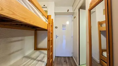 a small room with a bunk bed and a hallway at Résidence Andromede - Studio lumineux avec casier à ski · Proche des pistes · Balcon MAE-7403 in Flaine