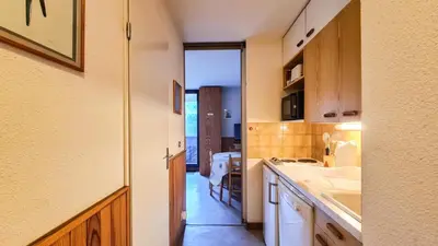 a kitchen with a sink and a counter top at Résidence Doris - Studio lumineux · Centre station · Balcon MAE-7404 in Flaine