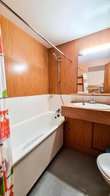 a bathroom with a tub and a sink and a toilet at Résidence Andromede - Studio spacieux · Proche des pistes MAE-7407 in Flaine