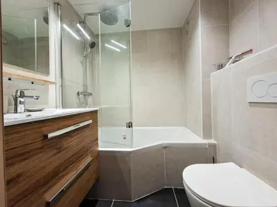 a bathroom with a toilet and a sink and a shower at Résidence Gemeaux - Studio confortable · Centre station · Balcon MAE-7410 in Flaine