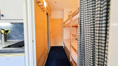 a small room with a kitchen and a sink at Résidence Andromede - Studio lumineux · Proche des pistes · Balcon avec jolie vue MAE-7419 in Flaine