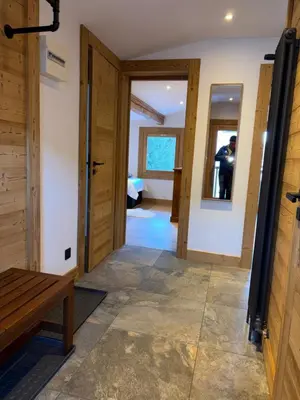 a bedroom with a bed and a dresser and a window at Penthouse Apartment, 3 Bedroom with Private Balcony in Chamonix-Mont-Blanc