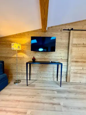 a kitchen with a white table and a white counter top at Penthouse Apartment, 3 Bedroom with Private Balcony in Chamonix-Mont-Blanc
