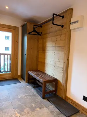 a large wooden building with a balcony in the snow at Penthouse Apartment, 3 Bedroom with Private Balcony in Chamonix-Mont-Blanc