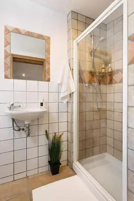 a bedroom with a large bed and a red dresser at 3 Bedrooms, Whole floor, New Kitchen, Town Centre in Chamonix-Mont-Blanc