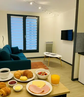 a living room with a table with food on it at Cosy Nest Near Center Chamonix in Chamonix-Mont-Blanc