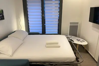 a hospital room with a bed and a table at Cosy Nest Near Center Chamonix in Chamonix-Mont-Blanc