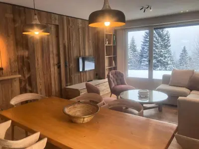 a living room with a table and chairs and a couch at Résidence Les Planes - Planes 2 MAE-5206 in Saint-Gervais-les-Bains
