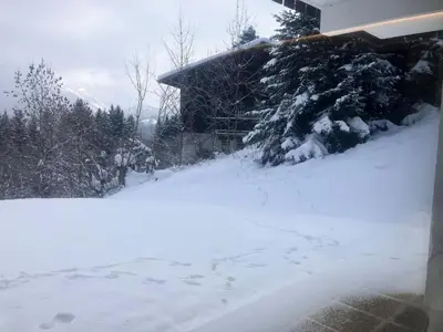 a yard covered in snow next to a house at Résidence Les Planes - Planes 2 MAE-5206 in Saint-Gervais-les-Bains
