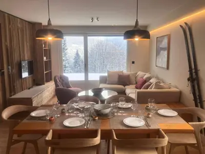 a living room with a table with wine glasses on it at Résidence Les Planes - Planes 2 MAE-5206 in Saint-Gervais-les-Bains