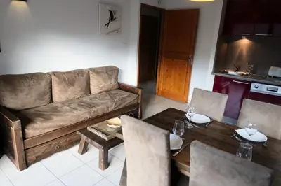 a living room with a couch and a table at Résidence Les Fermes De Saint Gervais - Fermes de Saint Gervais B20 MAE-5220 in Saint-Gervais-les-Bains