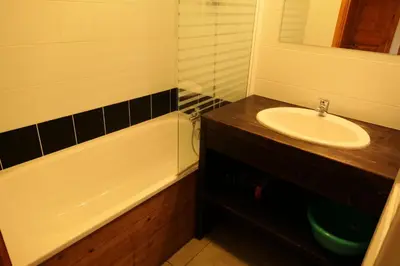 a bathroom with a sink and a bath tub at Résidence Les Fermes De Saint Gervais - Fermes de Saint Gervais B20 MAE-5220 in Saint-Gervais-les-Bains