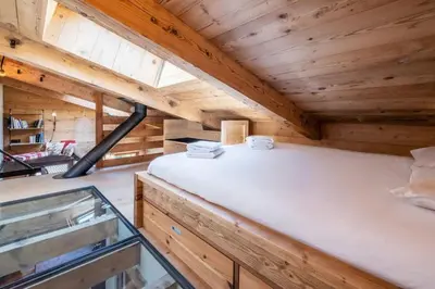 a room in a tiny house with a bed at Chalet Racar pour 4 personnes, centre ville et vue sur la montagne in Chamonix-Mont-Blanc