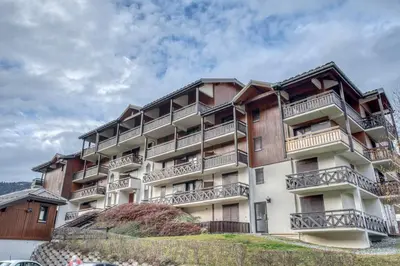 an apartment building with balconies on a hill at Studio Cosy coin-nuit proche centre - Vue splendide in Saint-Gervais-les-Bains
