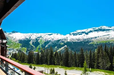 a view from a balcony of a snow covered mountain at Private penthouse 2-bed Apartment, ski in and out in 5* Flaine Residence in Flaine