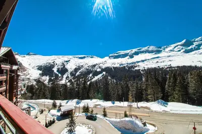 a view of a snow covered mountain from a building at Private penthouse 2-bed Apartment, ski in and out in 5* Flaine Residence in Flaine