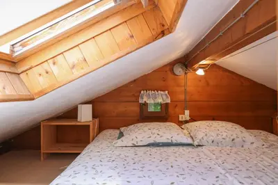 a bedroom with a bed in a attic at Le Chalet du Petit Ours in Chamonix-Mont-Blanc
