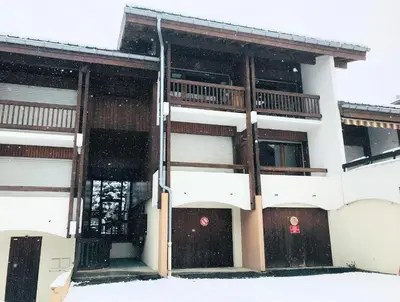 a building in the snow with snow at Oree Studio Mezzanine in Megève
