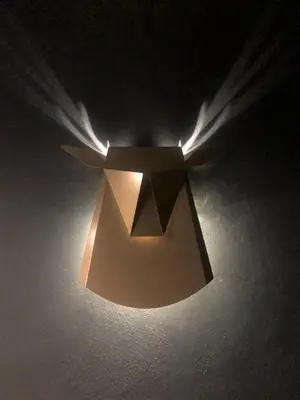 a lamp with a light in the dark at Duplex avec sauna et vue Mont Blanc au centre de Chamonix in Chamonix-Mont-Blanc