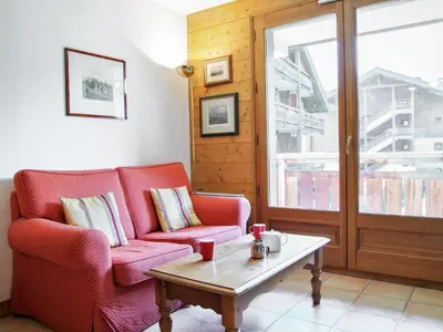 a living room with two chairs and a coffee table at Apartment Les Capucins by Interhome in Chamonix-Mont-Blanc