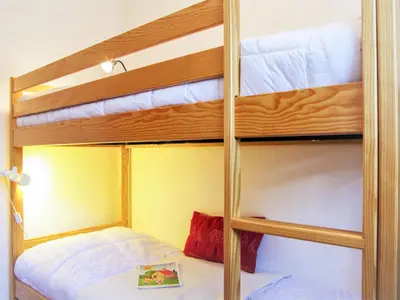 a bunk bed room with two bunk beds at Apartment Les Capucins by Interhome in Chamonix-Mont-Blanc