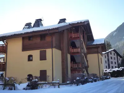 a large building with snow on the roof at Apartment Les Capucins by Interhome in Chamonix-Mont-Blanc