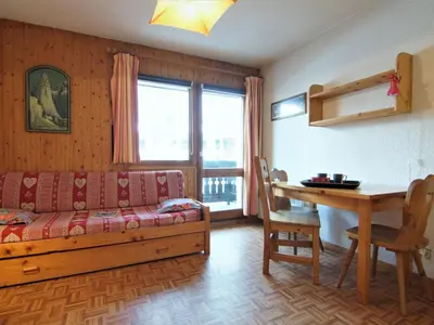 a living room with a couch and a table at Studio Les Jardins du Mont-Blanc-4 by Interhome in Chamonix-Mont-Blanc