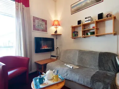 a red kitchen with a sink and a microwave at Apartment Le Chailloud-2 by Interhome in Chamonix-Mont-Blanc