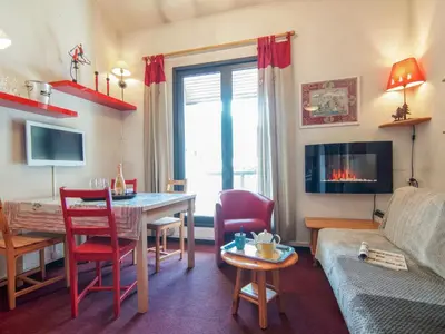 a kitchen with a table with a white table cloth at Apartment Le Chailloud-2 by Interhome in Chamonix-Mont-Blanc