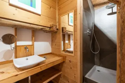 a bathroom with a sink and a shower at Authenthic Chalet Ski on Les Houches Chamonix in Les Houches