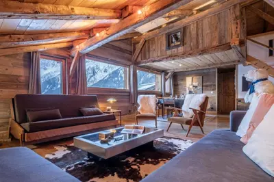 a living room with a couch and a table at Authenthic Chalet Ski on Les Houches Chamonix in Les Houches