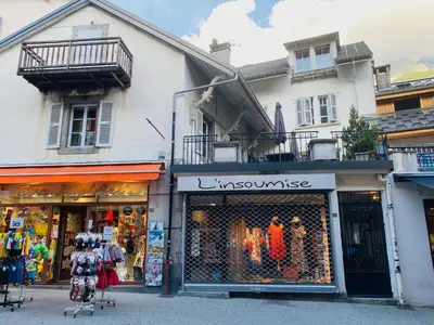a store on a street in front of a building at Villa Léon in Chamonix-Mont-Blanc