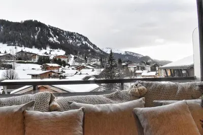 a view of a snowy mountain from a window at Apartment WABI-SABI by JAPANDI home in Megève