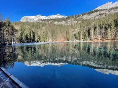 a view of a lake with mountains in the background at Chalet du grand cerf in Servoz