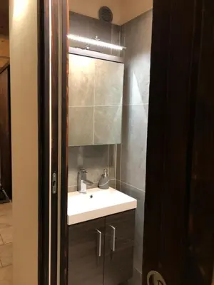 a bathroom with a sink and a mirror at Chalet Plan Glacier in Chamonix-Mont-Blanc