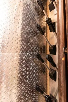 a sliding glass door with black handles and a metal wall at Chalet Plan Glacier in Chamonix-Mont-Blanc