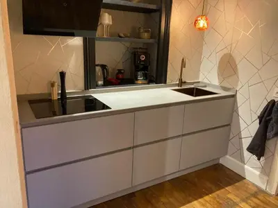 a kitchen with a sink and a counter top at Elegant historic apartment Le Mont Joly - 3 bed 2bath view 80m2 in Saint-Gervais-les-Bains