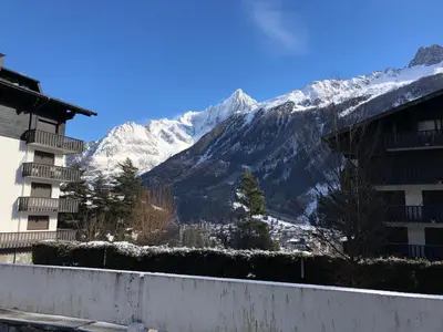 a view of a snow covered mountain from a building at Snow Rabbit Lodge in Chamonix-Mont-Blanc