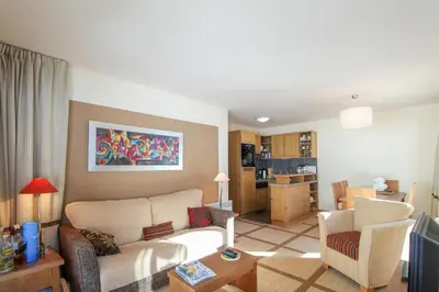 a living room with a couch and two chairs at Spacious Family 2-bed, 2-bath with parking, private piste in Flaine