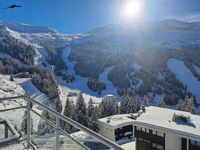 a view of a snow covered valley with a building at Penthouse 3-bedroom apartment, mountain views, large terrasse, piste access in Flaine