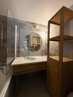 a bathroom with a sink and a mirror at Chamonix / Argentière - Duplex 6p in Chamonix-Mont-Blanc