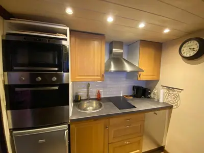 a kitchen with a sink and a stove top oven at Chamonix / Argentière - Duplex 6p in Chamonix-Mont-Blanc