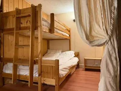 a bedroom with two bunk beds in a room at Chamonix / Argentière - Duplex 6p in Chamonix-Mont-Blanc
