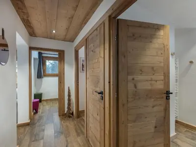 a room with a wooden door in a house at CHALET 