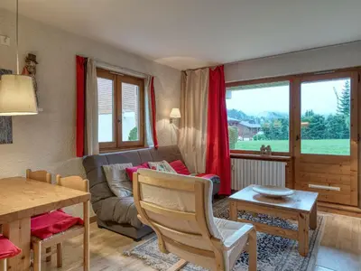 a living room with a couch and a table at Appartement 2 pièces avec terrasse, animaux admis, proche pistes - Megève - FR-1-453-225 in Megève
