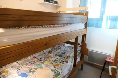 a bunk bed in a room with a wooden bunk bed at Résidence Jaspe - Jaspe 1123 MAE-2444 in Saint-Gervais-les-Bains